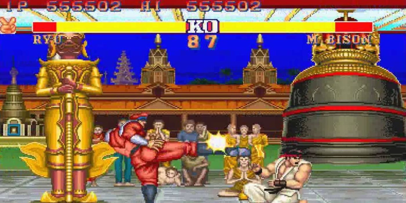 M Bison kicking Ryu in the head in Street Fighter 2.
