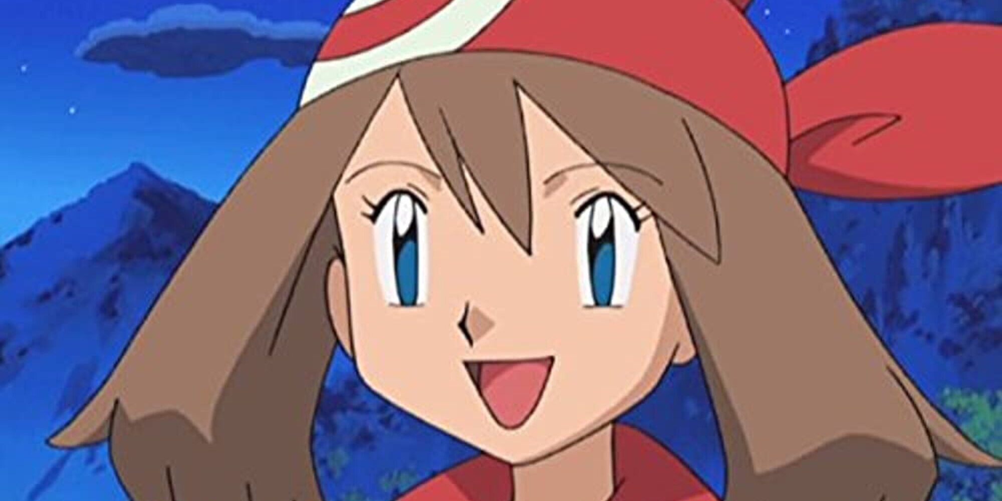 An image of May smiling in a scene from Pokemon.