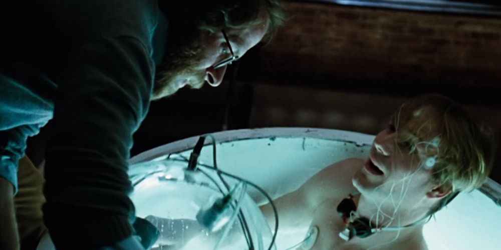Two Characters from Altered States using a sensory deprivation tank, looking identical to the tank in Stranger Things.