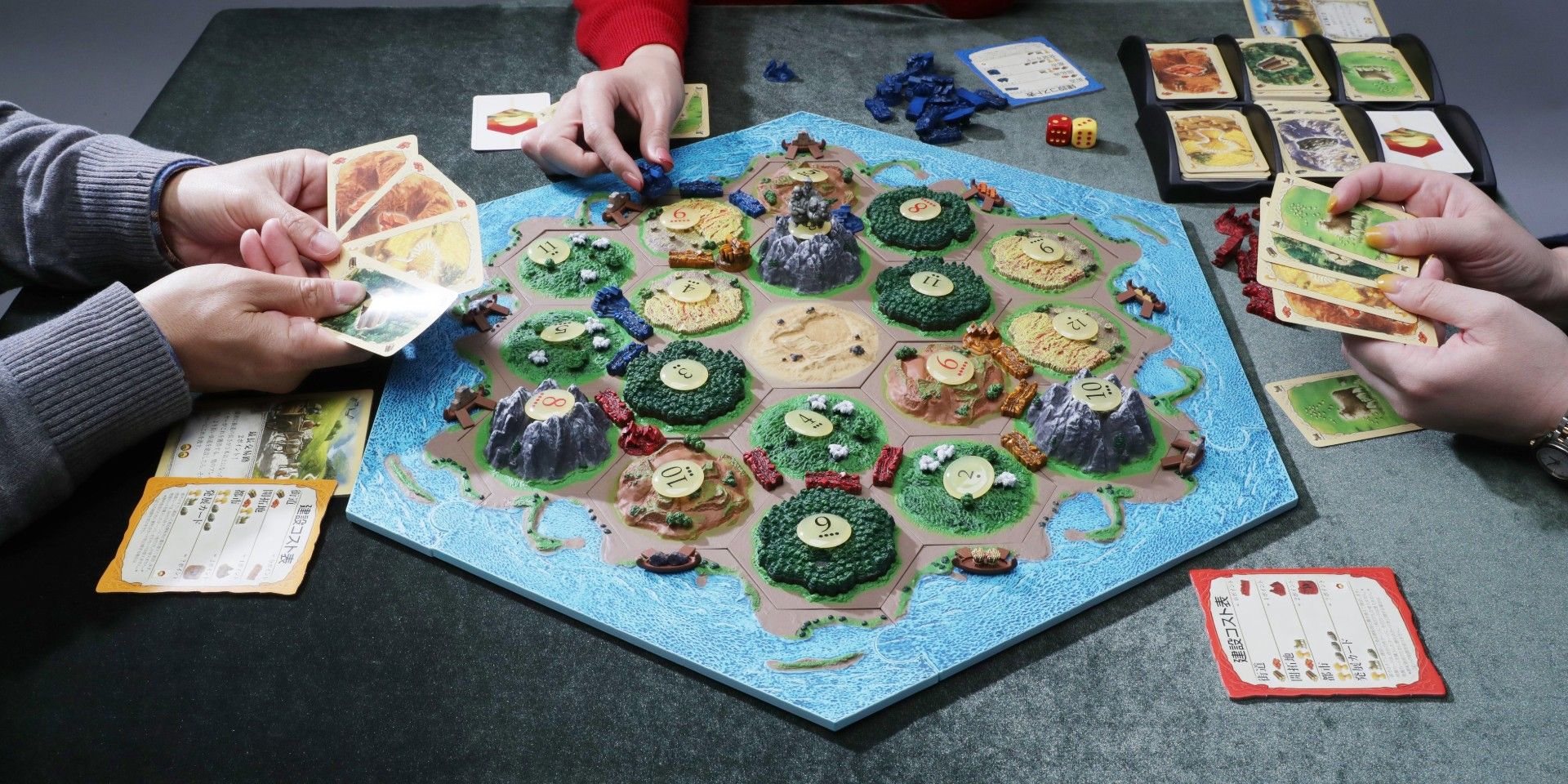 Several players with a 3D version of Settlers of Catan.