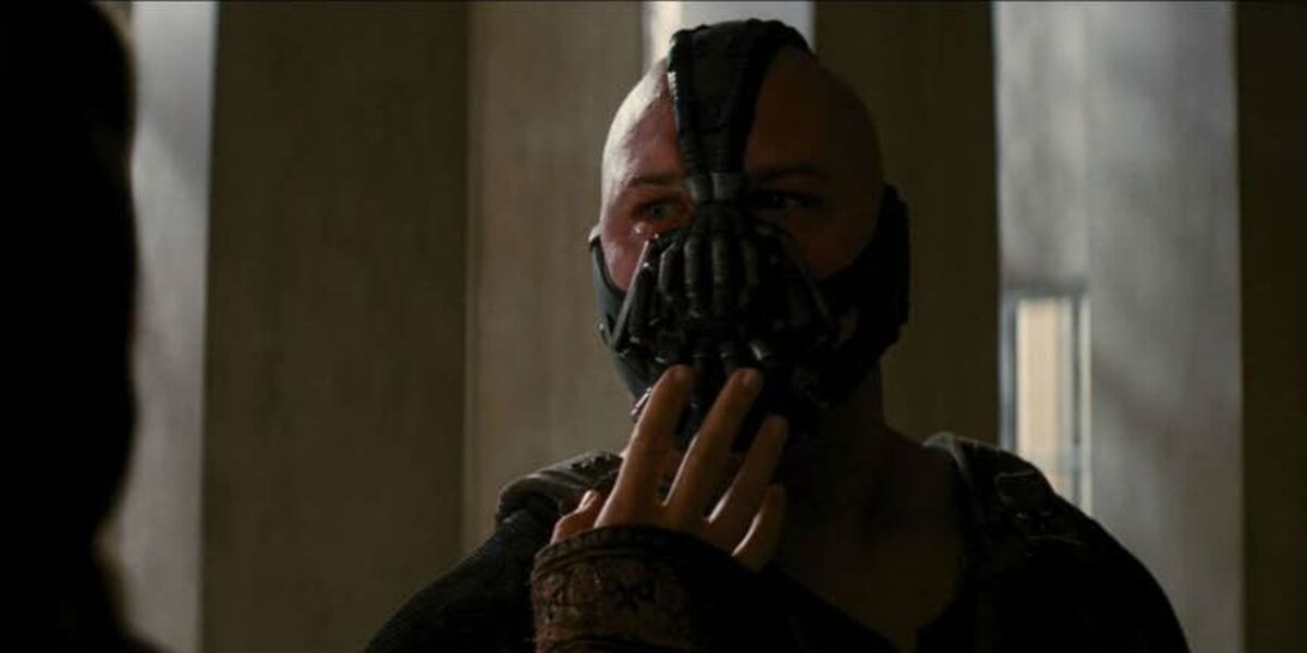 Talia fixes Bane's mask