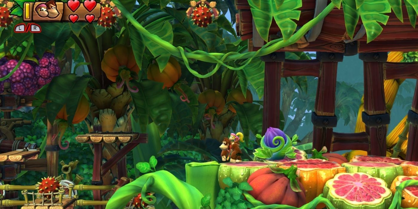 Dixie Kong platforming in the Juicy Jungle in Nintendo's Donkey Kong Country Tropical Freeze