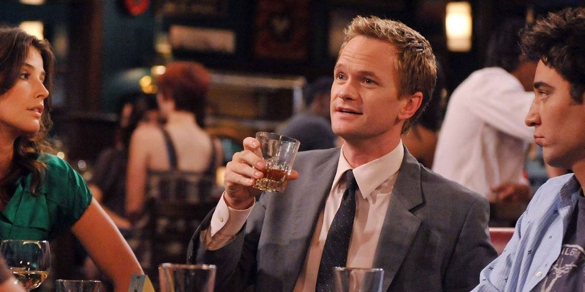 Barney Stinson having a drink with Robin and Ted in How I Met Your Mother 