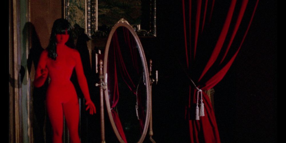 the killer in a red bodysuit in front of a mirror in Blood and Black Lace