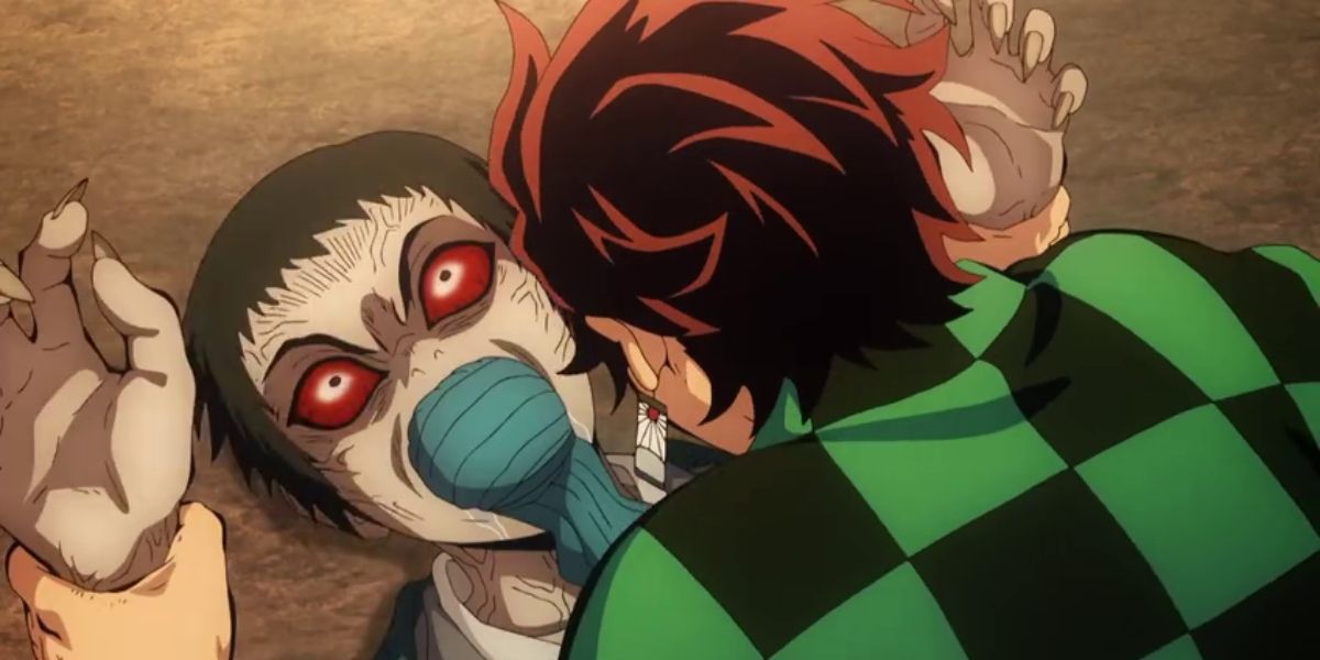 Tanjiro gagging a demon and holding him down in Demon Slayer.