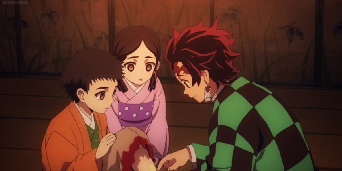 Tanjiro treating Kiyoshi's wounds in Demon Slayer.