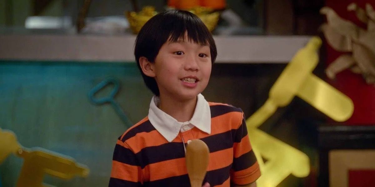 Evan Huang smiling in the TV series, Fresh off the Boat