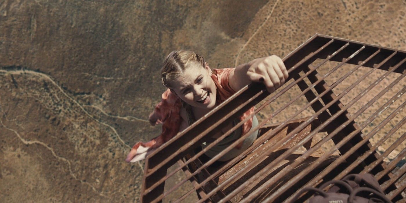 Hunter (Virginia Gardner) clings to the tower's ledge in Fall