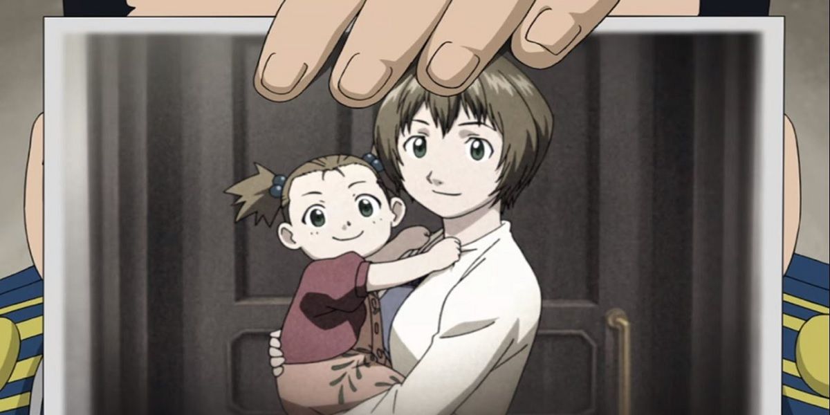 Hughes holding up a picture of his wife and daughter in Fullmetal Alchemist: Brotherhood.