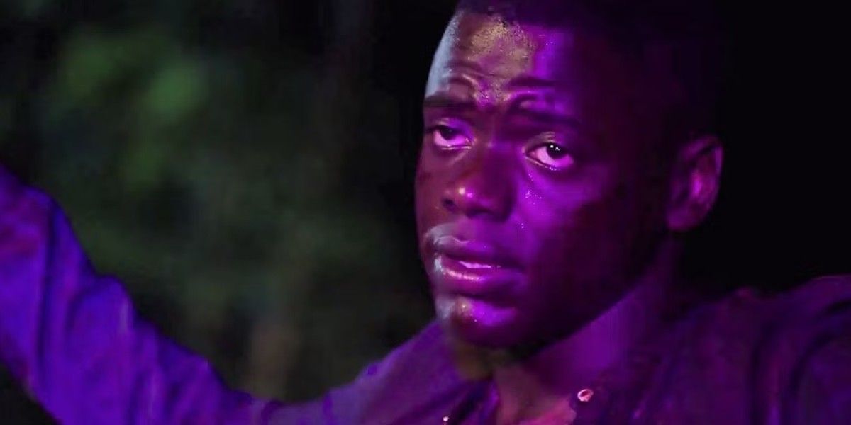Daniel Kaluuya raises his hands at the end of Get Out