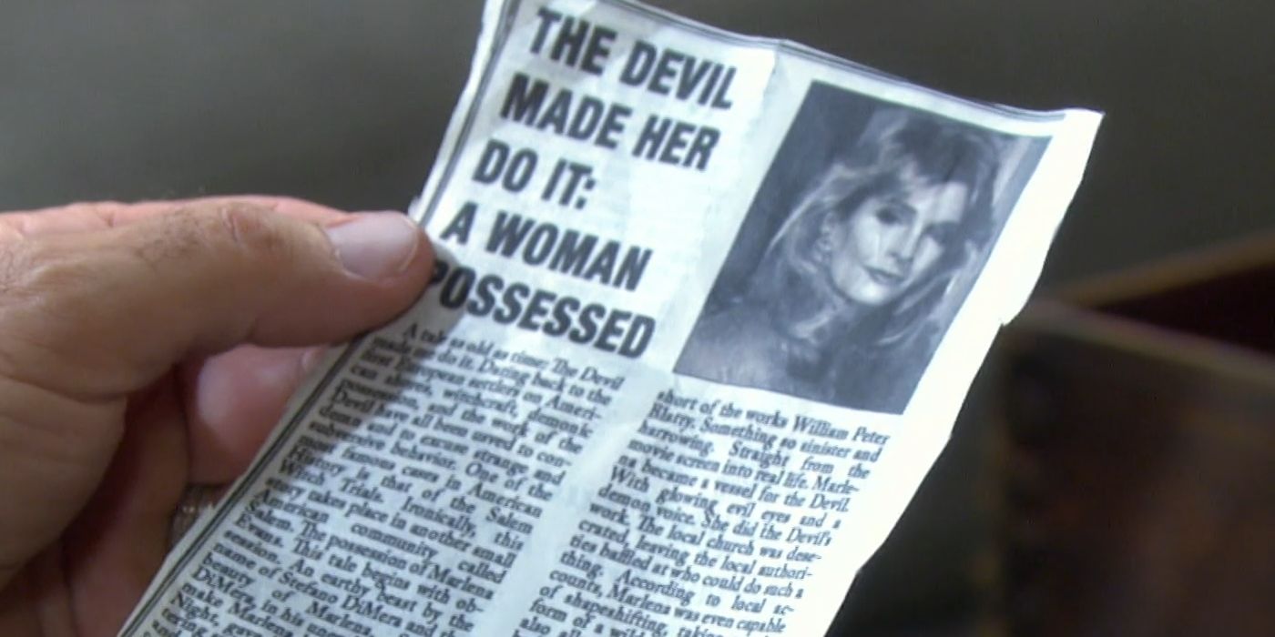 John Black holds a newspaper clipping detailing Marlena Evans time possessed by Satan on Days of Our Lives
