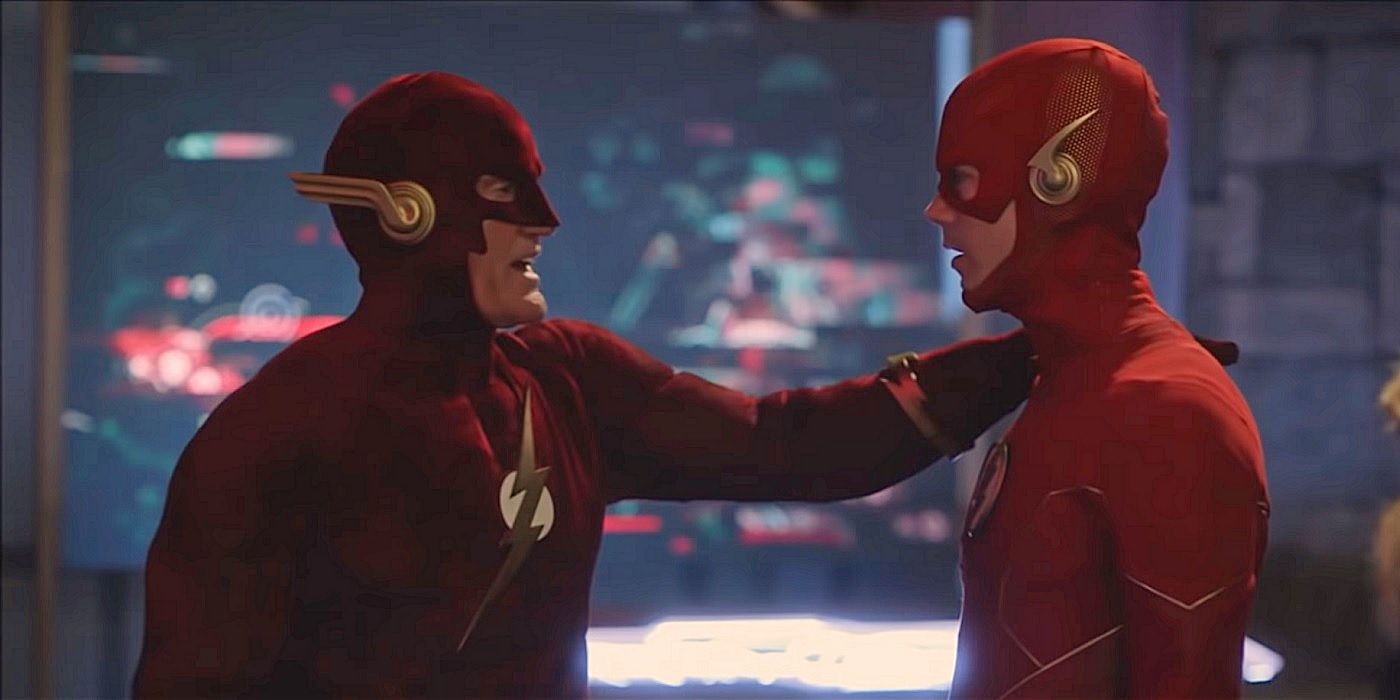 John Wesley Shipp and Grant Gustin as the two versions of The Flash talking to one another in costume. 