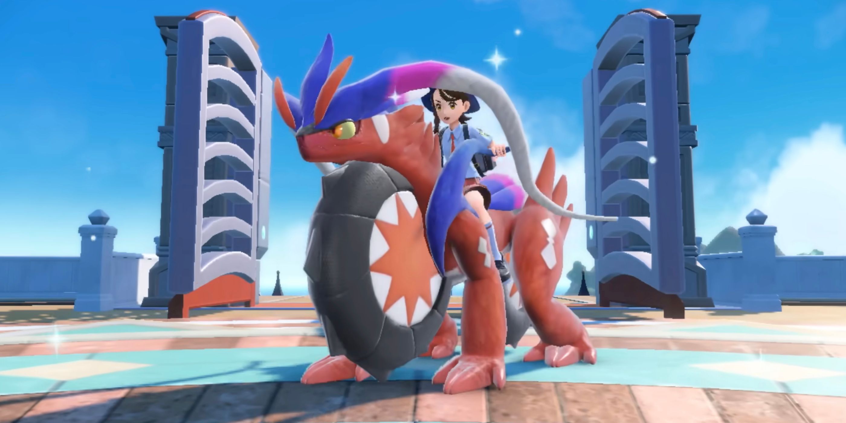 A player riding atop the Legendary Pokémon Koraidon in Pokémon Scarlet.