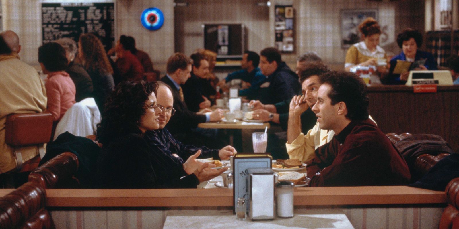 The Seinfeld Gang at Monk's Cafe.