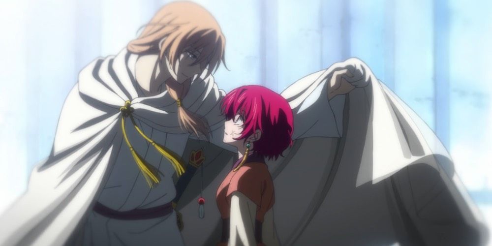 Su-Won and Yona from Yona of the Dawn staring at each other as Su-Won looms over Yona.