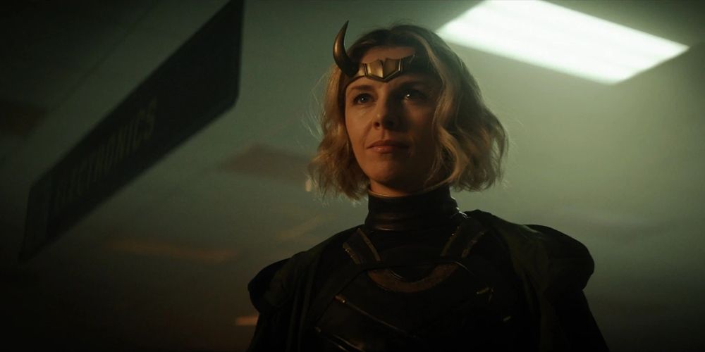 Sylvie Laufeydottir in Loki TV series smiling under a ceiling light.