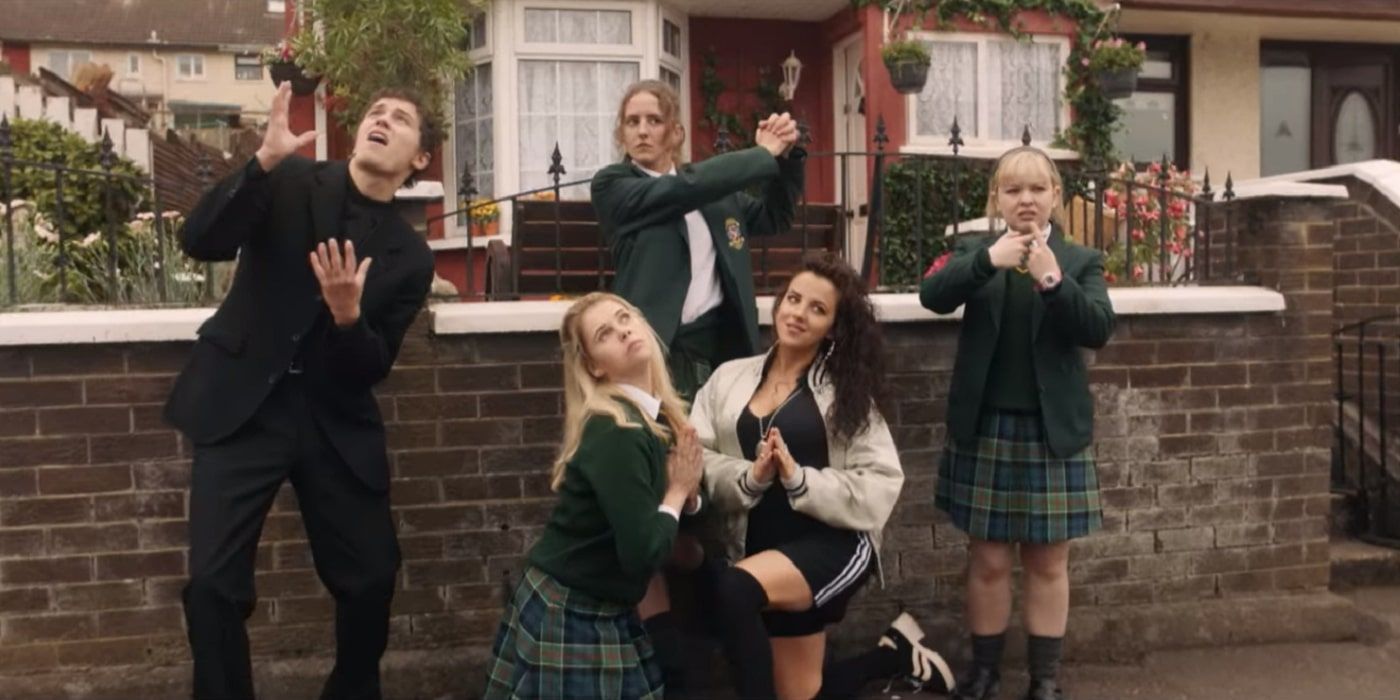The Derry Girls posing for a newspaper after faking a sign from God