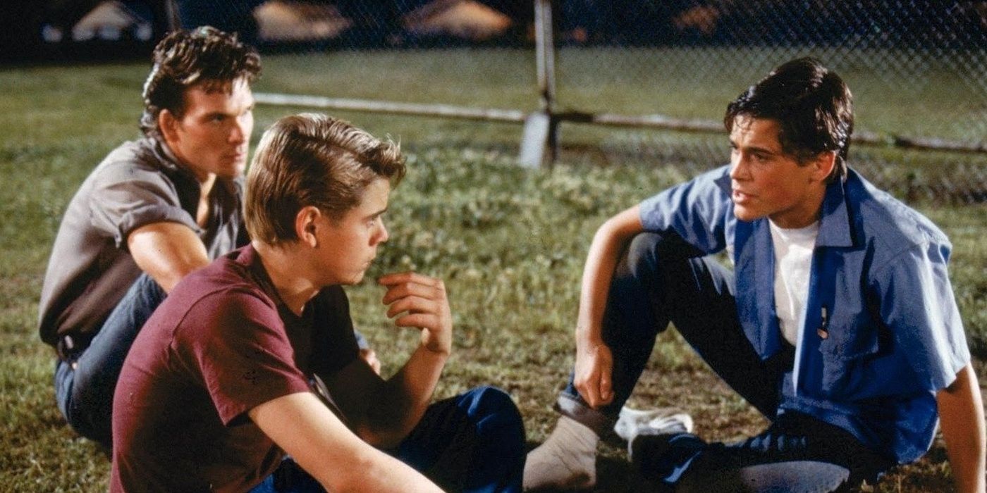 The Curtis brothers in the grass in The Outsiders