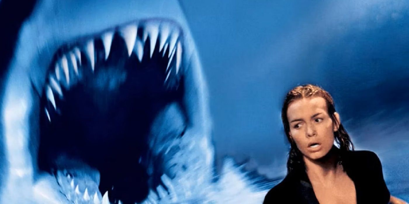 Saffron Burrows as Dr. Susan McCallister with a shark behind her in Deep Blue Sea