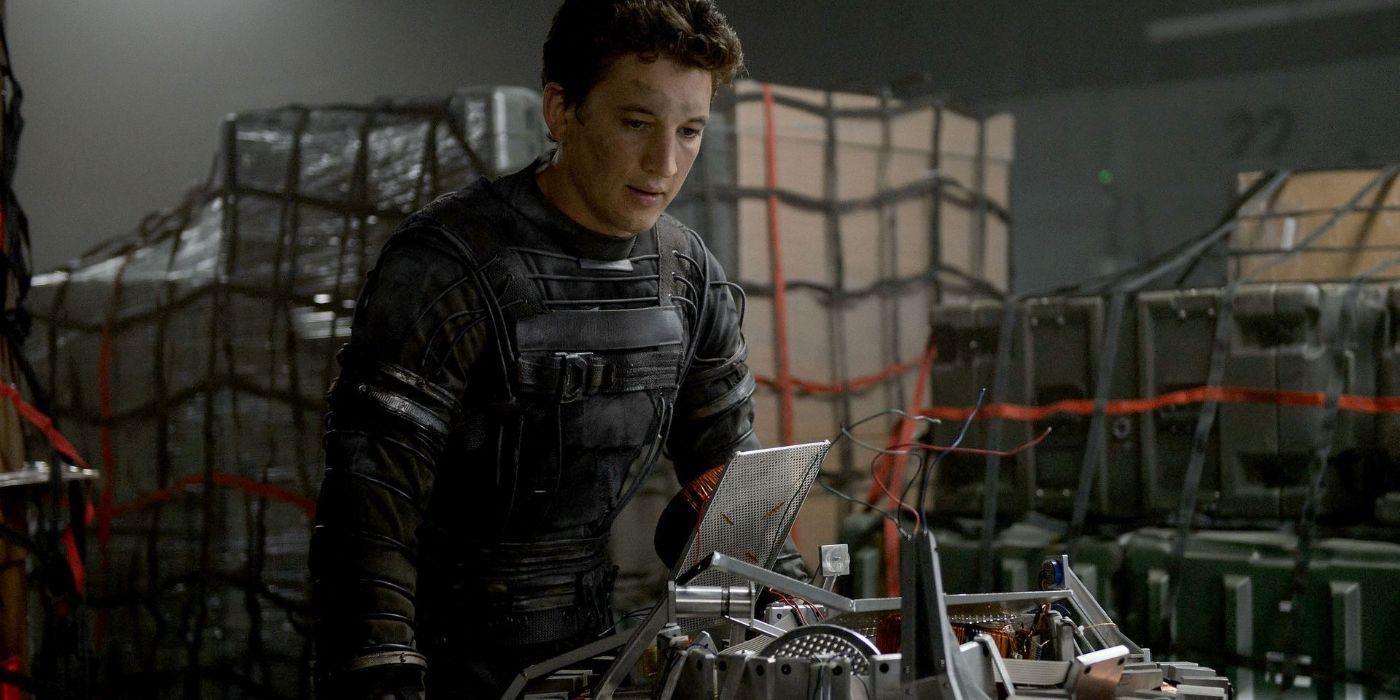 Miles Teller in 2015's Fantastic Four looking at technology