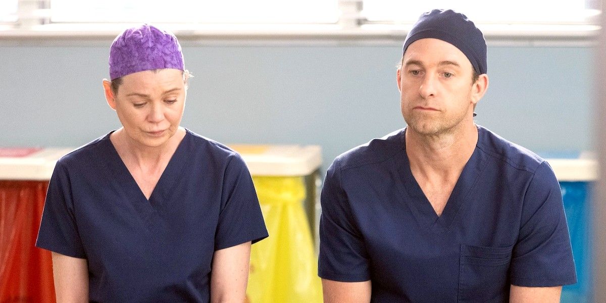  meredith and nick sitting in their scrubs on greys anatomy