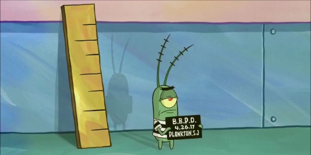 Plankton getting his mug shot taken while standing next to a ruler in Spongebob