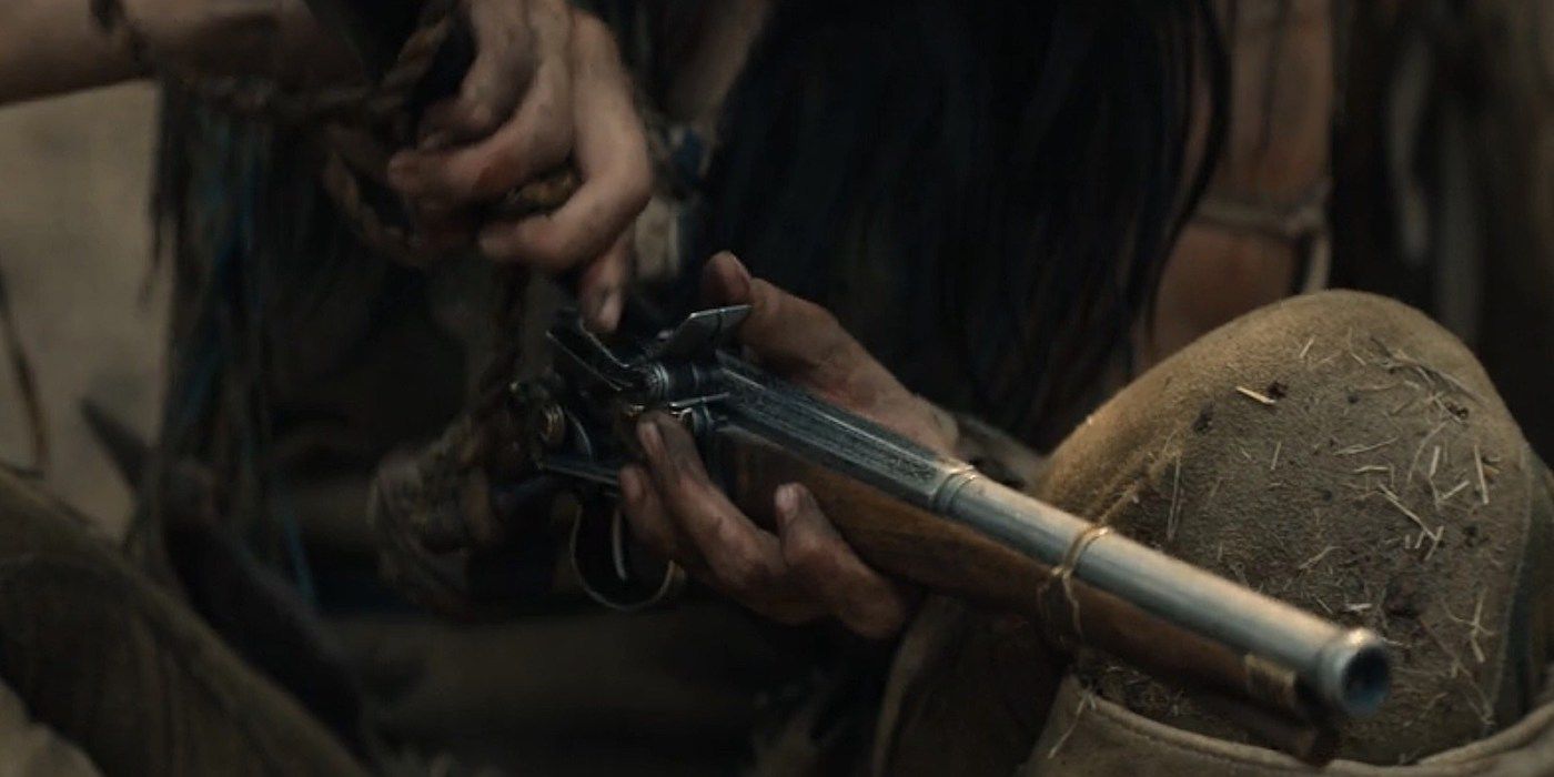Two characters exchange weapons during the Prey Predator movie.