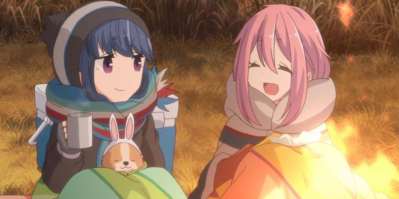 Rin and Nadeshiko smiling at each other at camp in Laid-Back Camp.