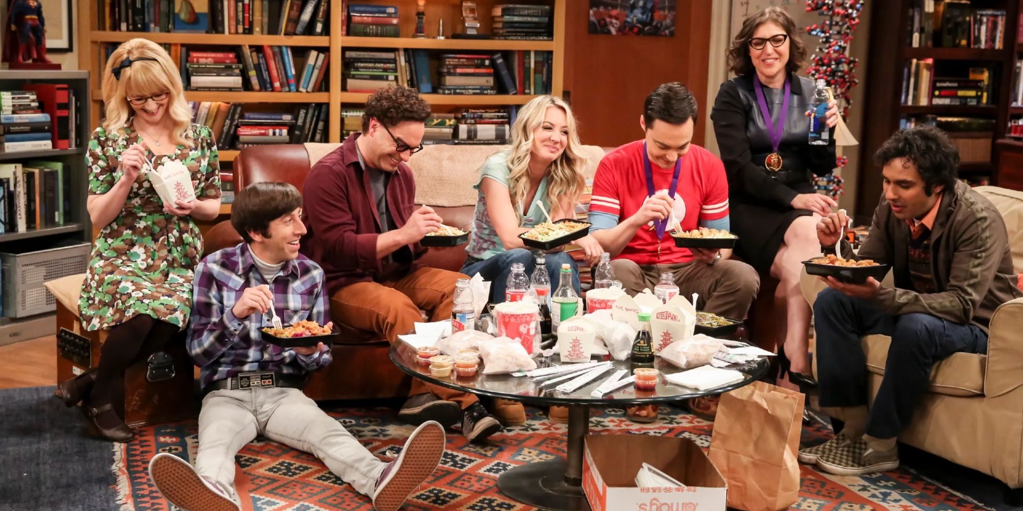 The main cast of The Big Bang Theory eating takeout.