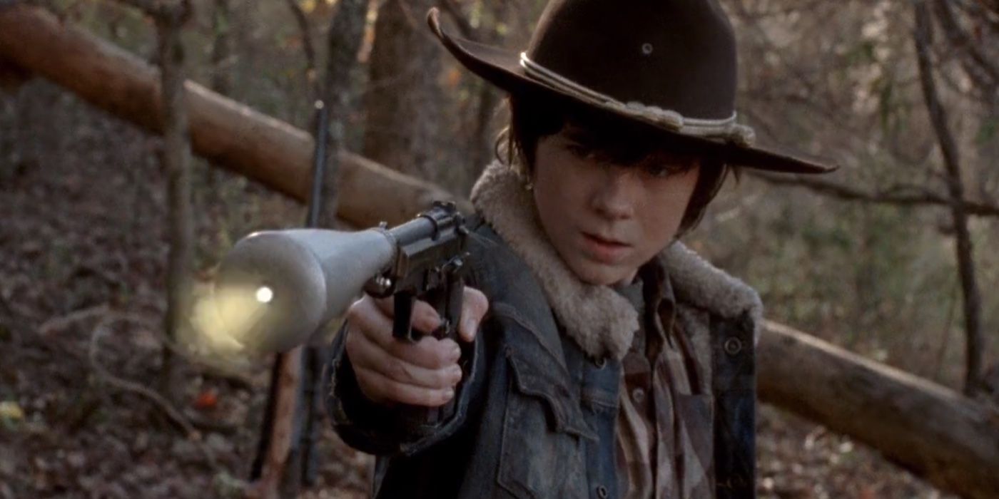 Carl Grimes shooting a gun on The Walking Dead
