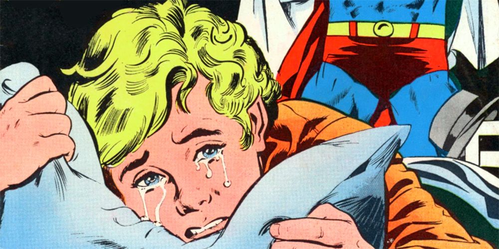 スーパーマンが服を脱ぎながら泣く男の子