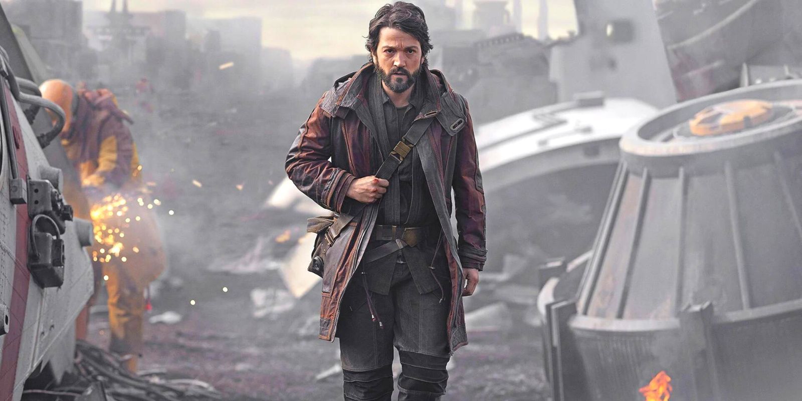 Cassian Andor walking through a shipyard