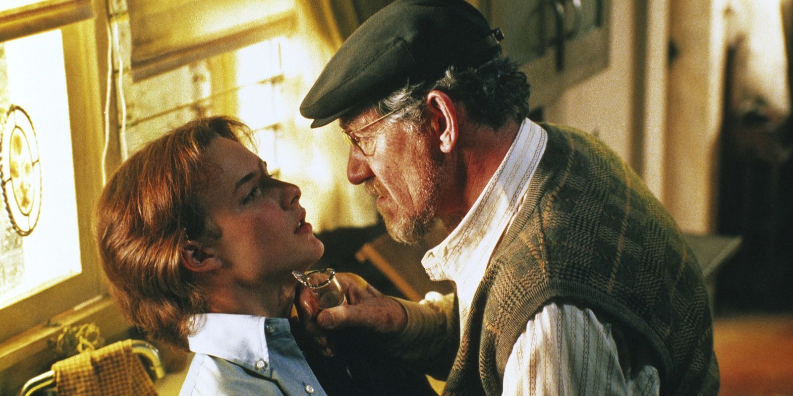 Dussander (Ian McKellen) threatens Todd (Brad Renfro) with a cracked bottle in Apt Pupil.