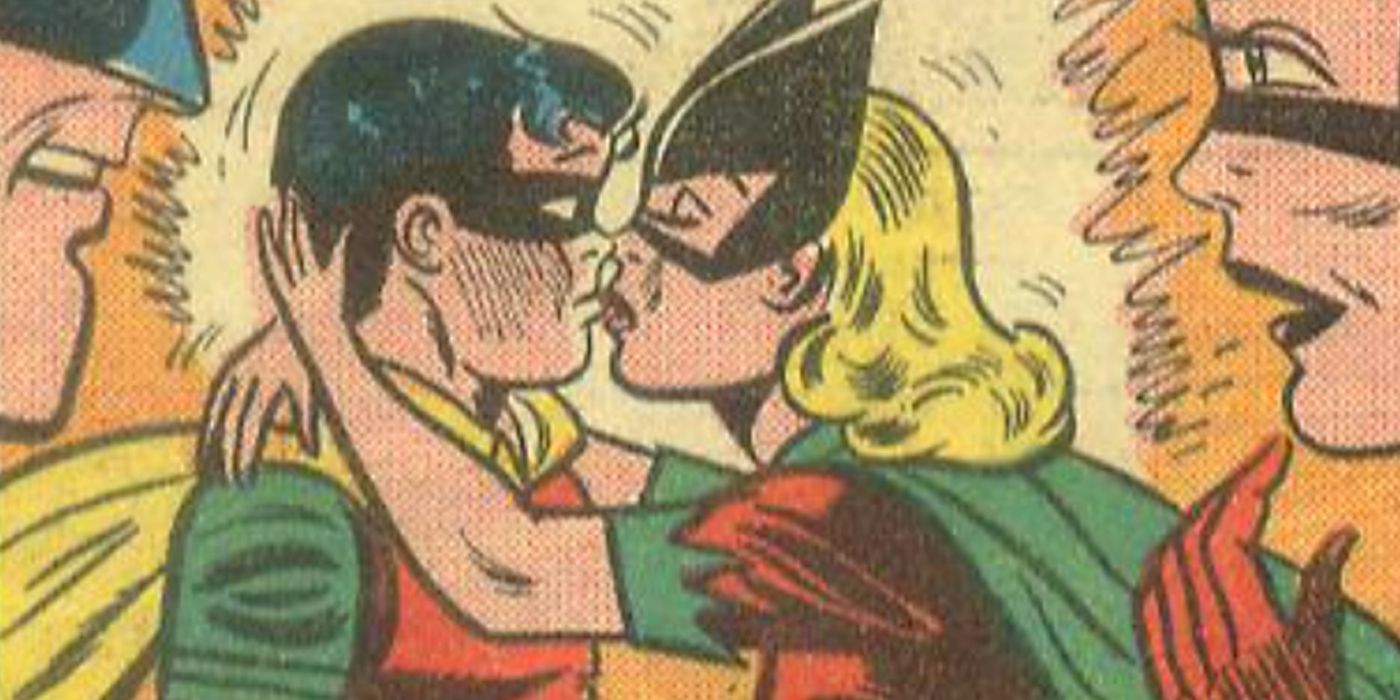 Bat-Girl kissing Robin while Batman and Bat-Woman watch in the comics