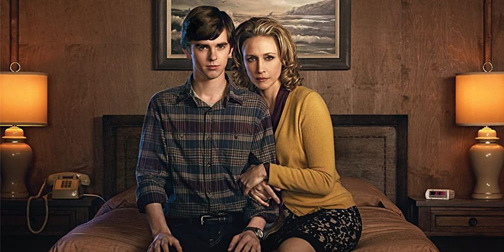 Norman and Norma Bates sitting on a bed in Bates Motel.