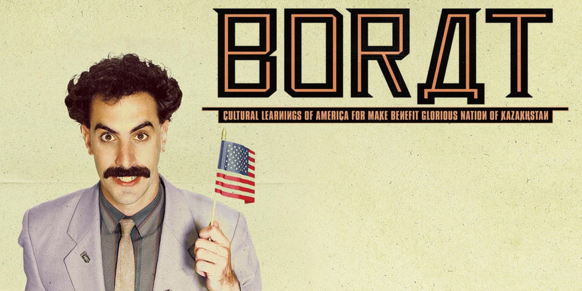 Borat waves a tiny American flag