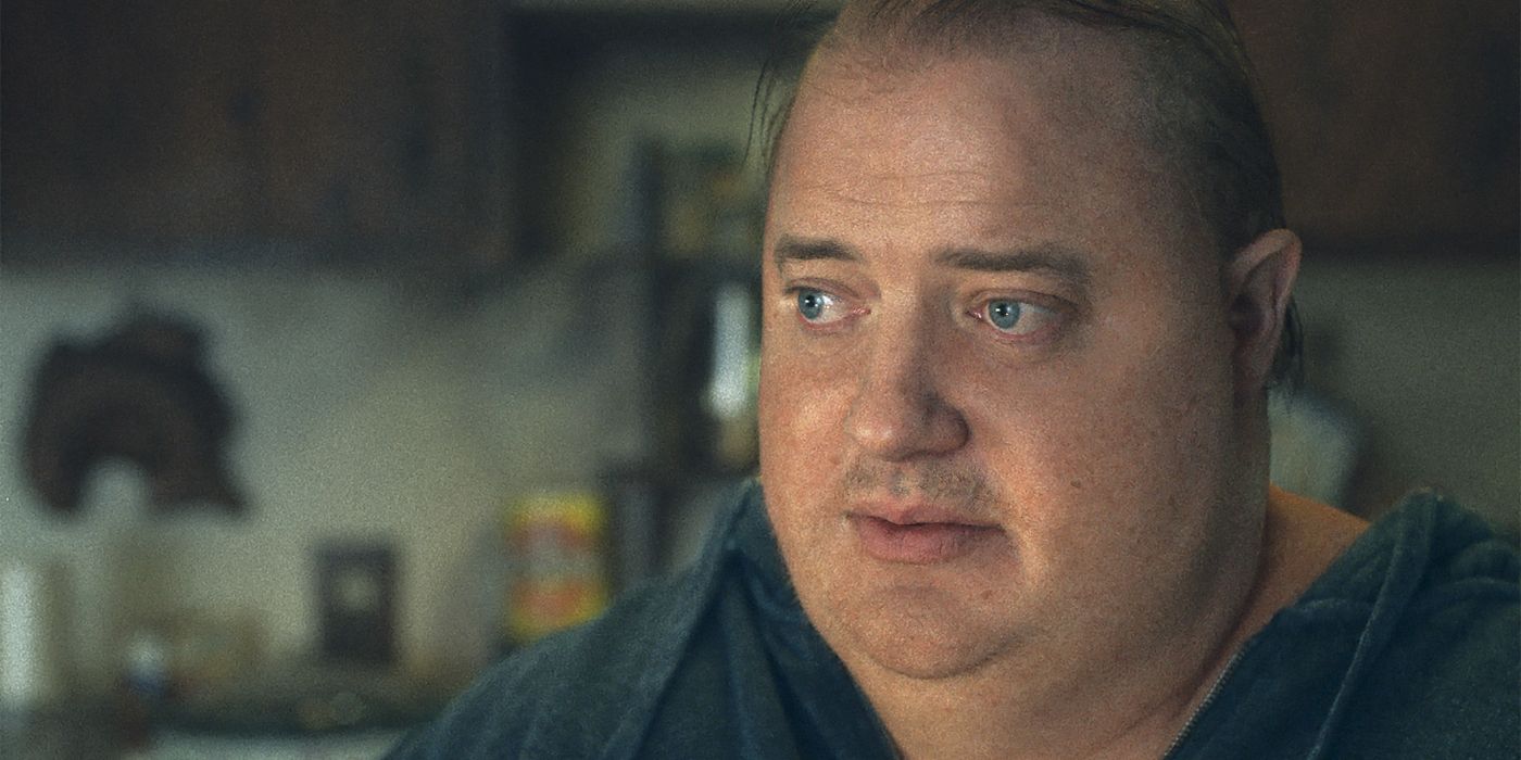 Brendan fraser sitting in the kitchen in a scene from the whale