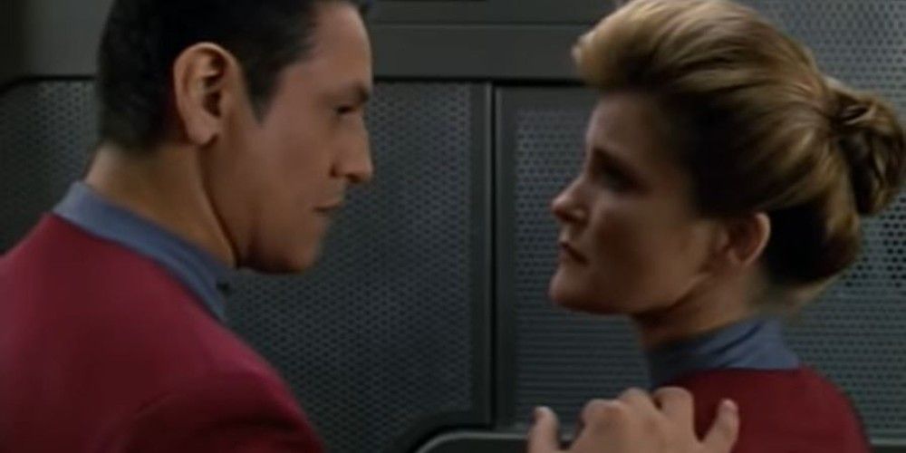 Chakotay comforting Janeway during a difficult moment