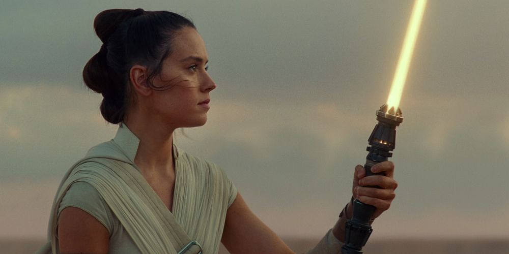 Rey activates her new lightsaber at the end of Star Wars: Episode IX, The Rise of Skywalker