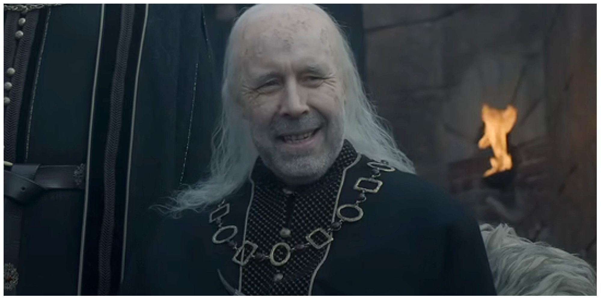 An old Viserys Targaryen smiling in House of the Dragon