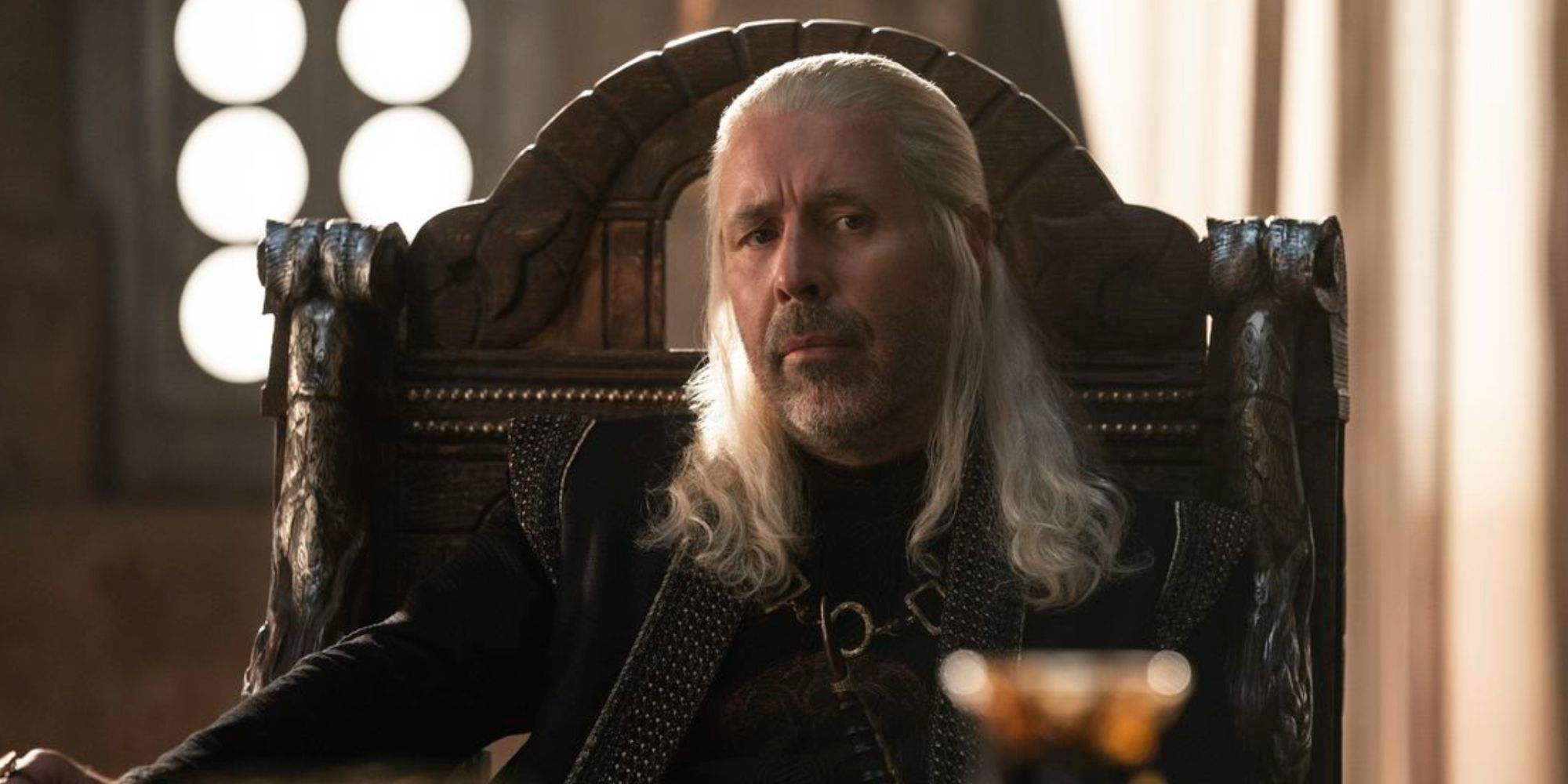 King Viserys Targaryen attending a Small Council meeting in House of the Dragon