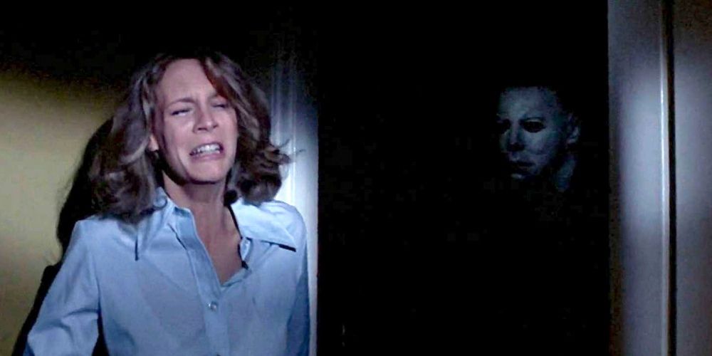 Michael Myers stalking Laurie Strode in John Carpenter's Halloween movie