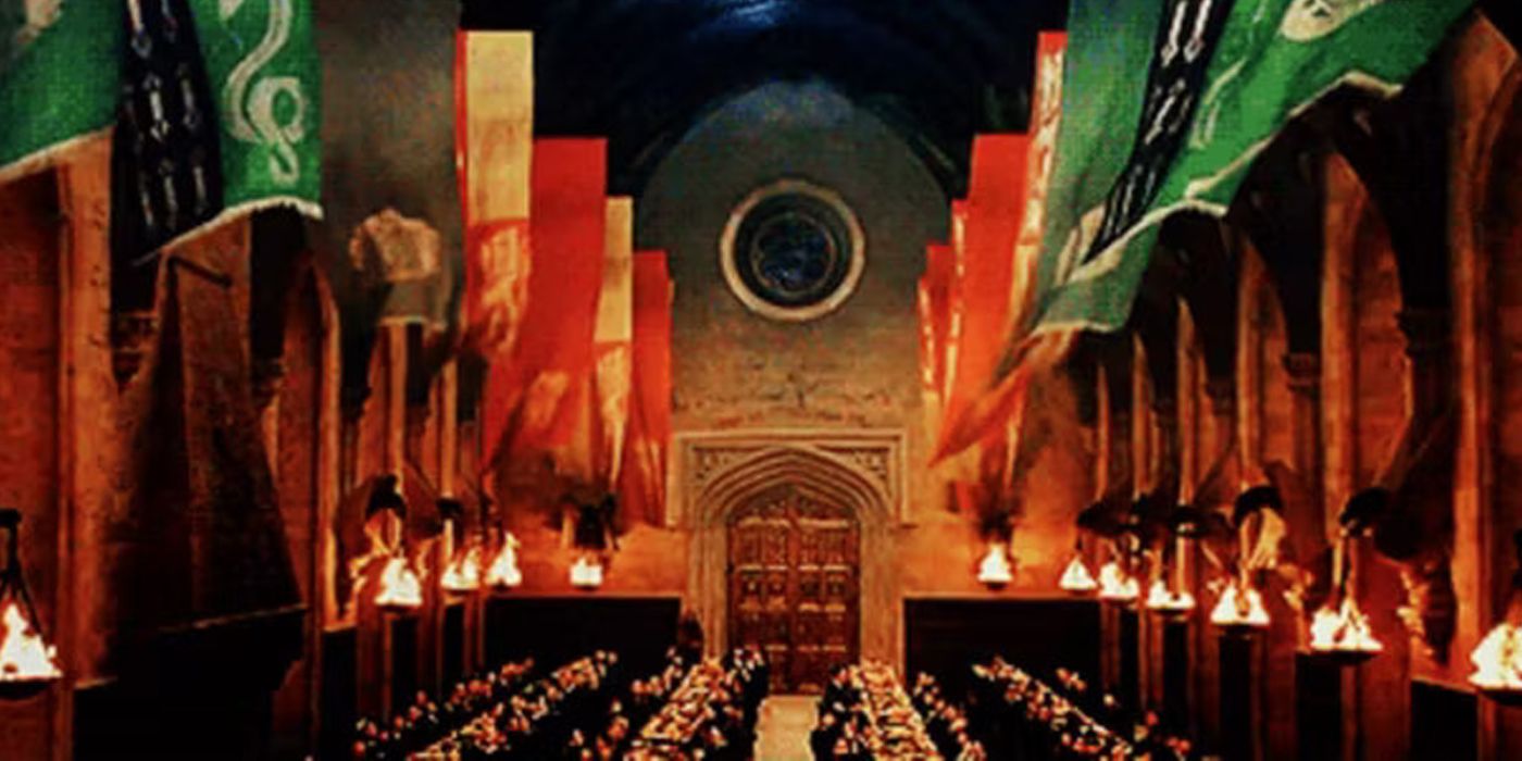 The House banners floating in the Hogwarts Great Hall as students eat their meal below