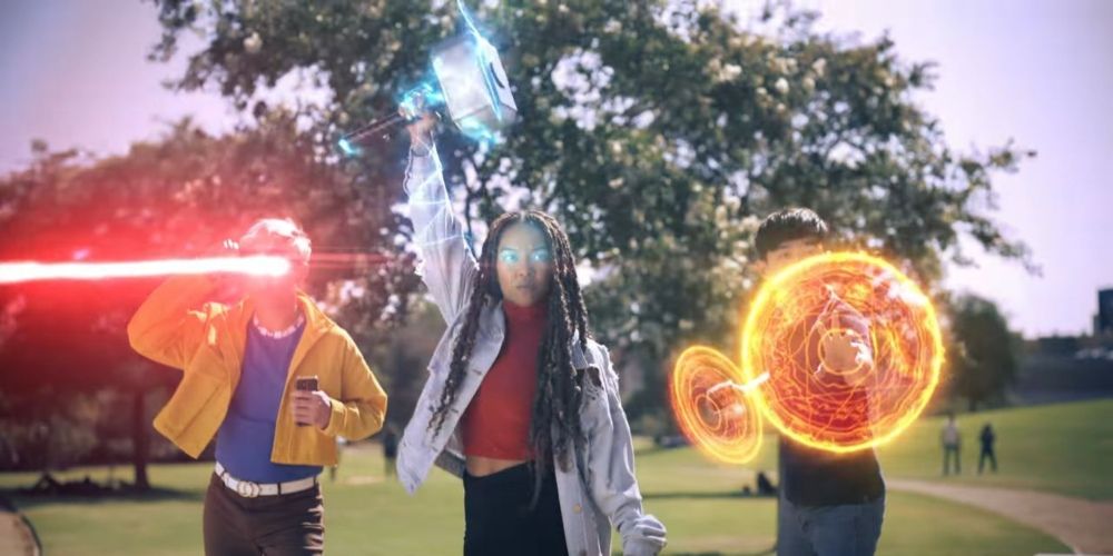 People using the powers of Cyclops, Thor, and Doctor Strange in the advert for Marvel World of Heroes game