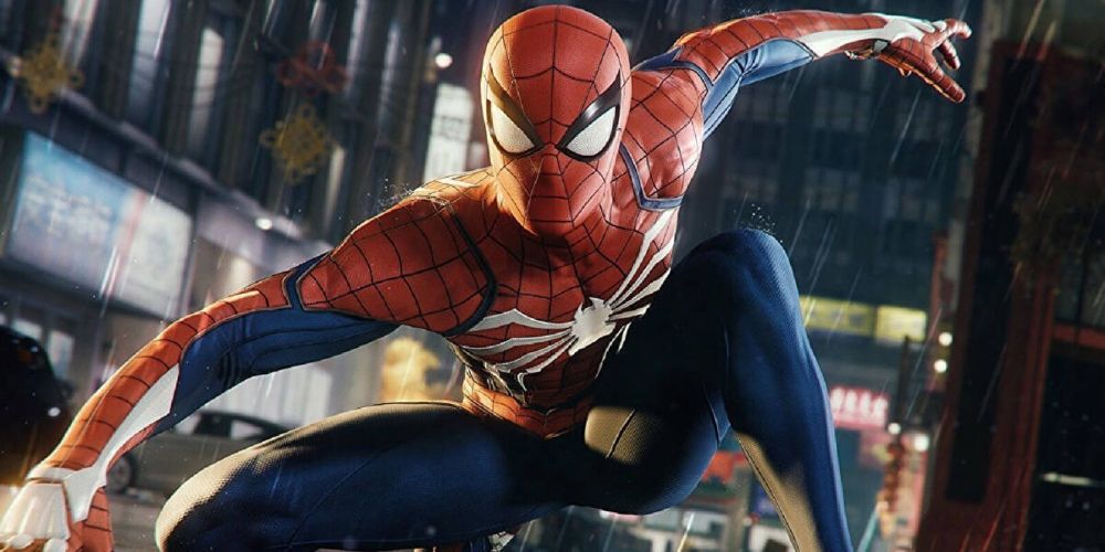 Peter Parker crouched on a car in Insomniac's Marvel's Spider-Man game