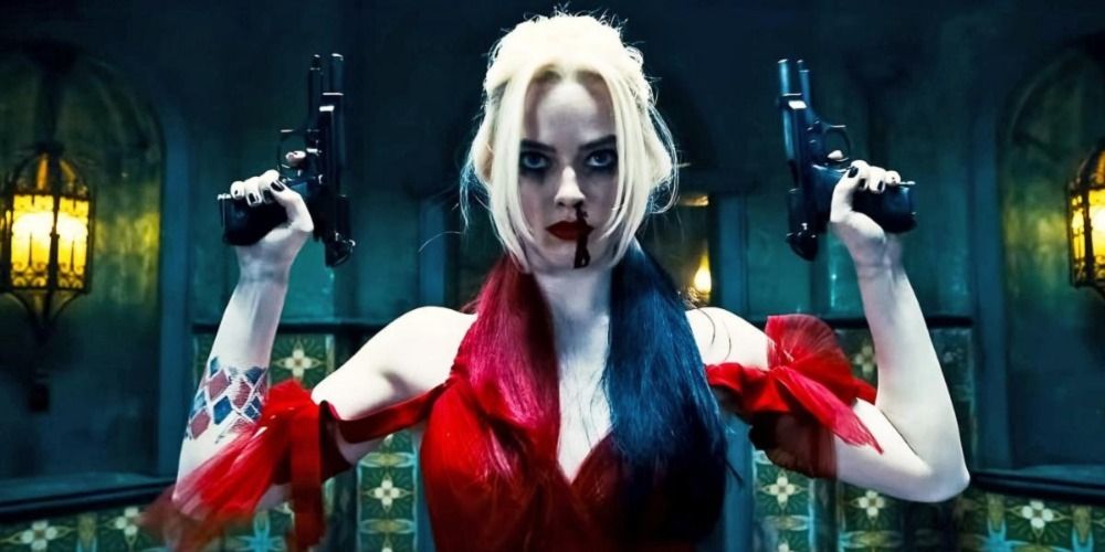 Harley Quinn holding her arms up, one gun in each hand, with a bloodied nose