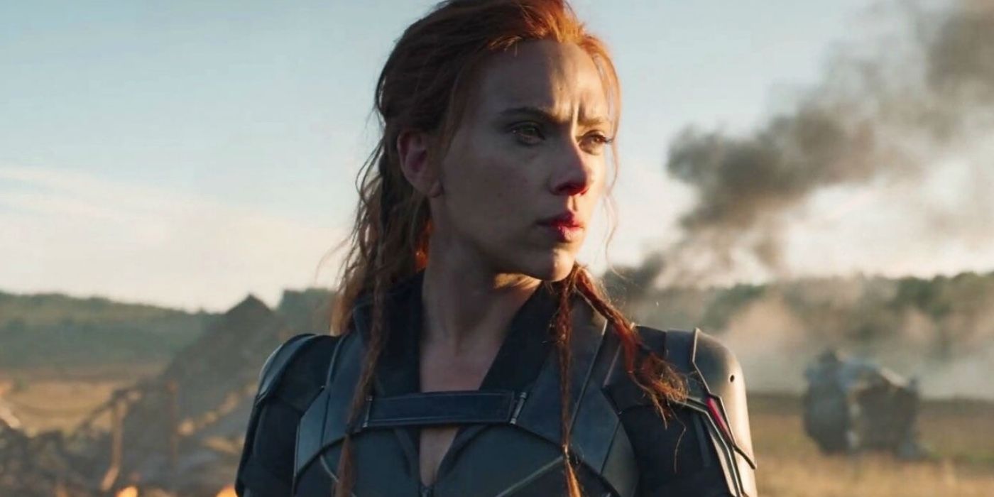 Natasha Romanoff standing before an explosion in Black Widow.