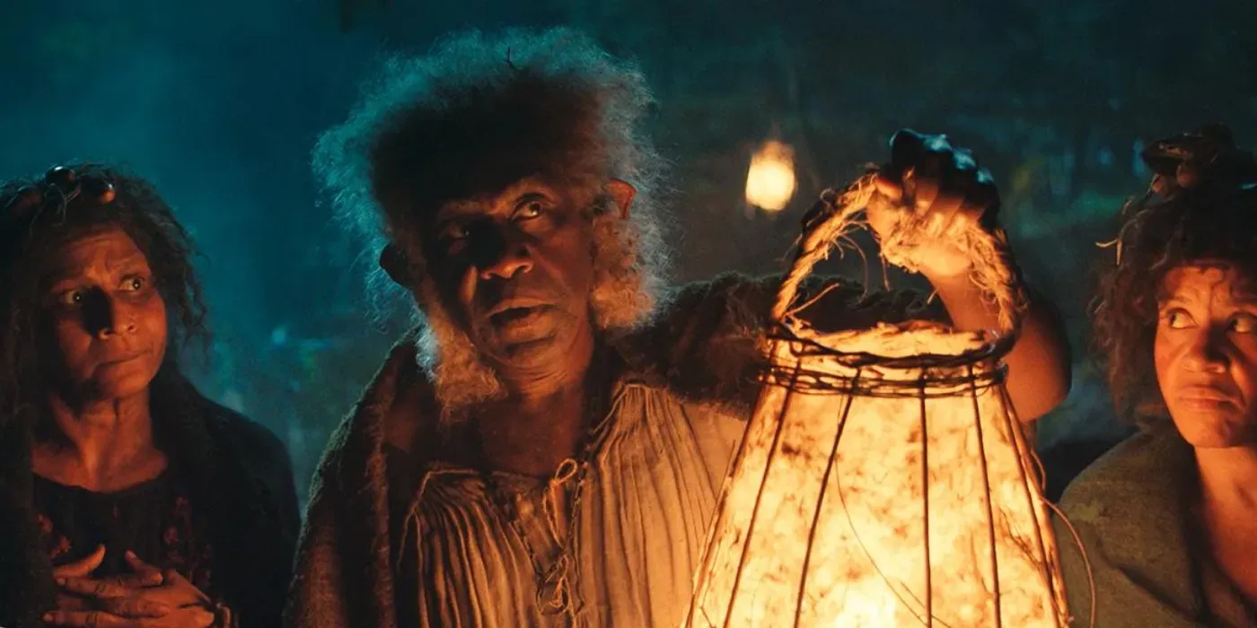 Sadoc Burrows played by Lenny Henry holding a lantern in the series: The Rings of Power