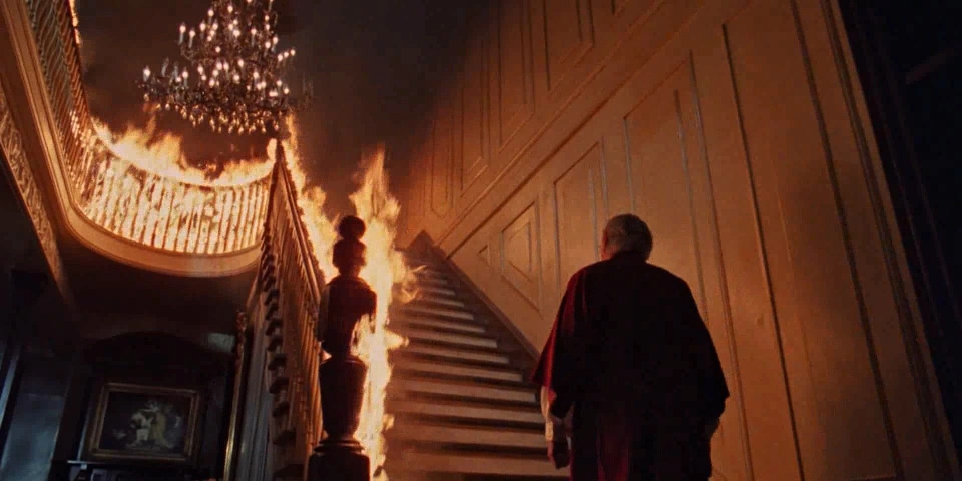 The man standing at the bottom of the burning stairs in The Changeling