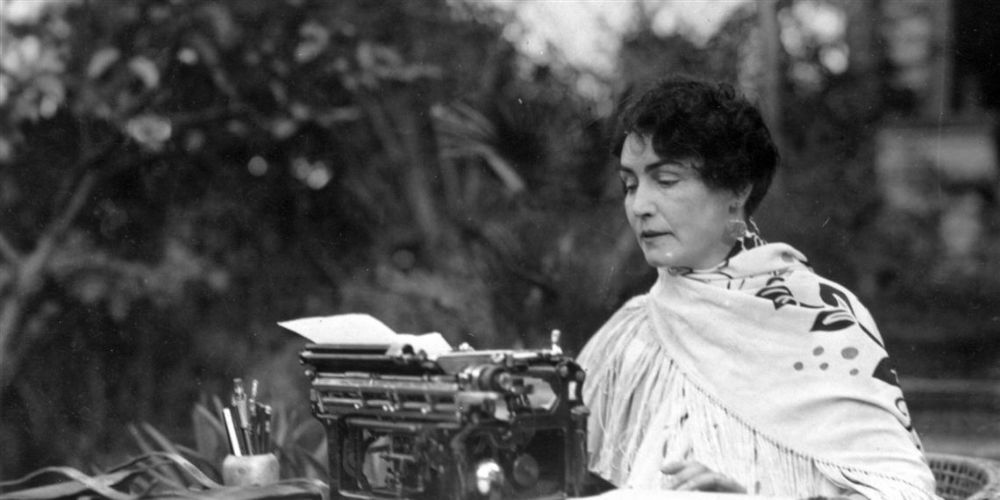 Lois Weber using a typewriter